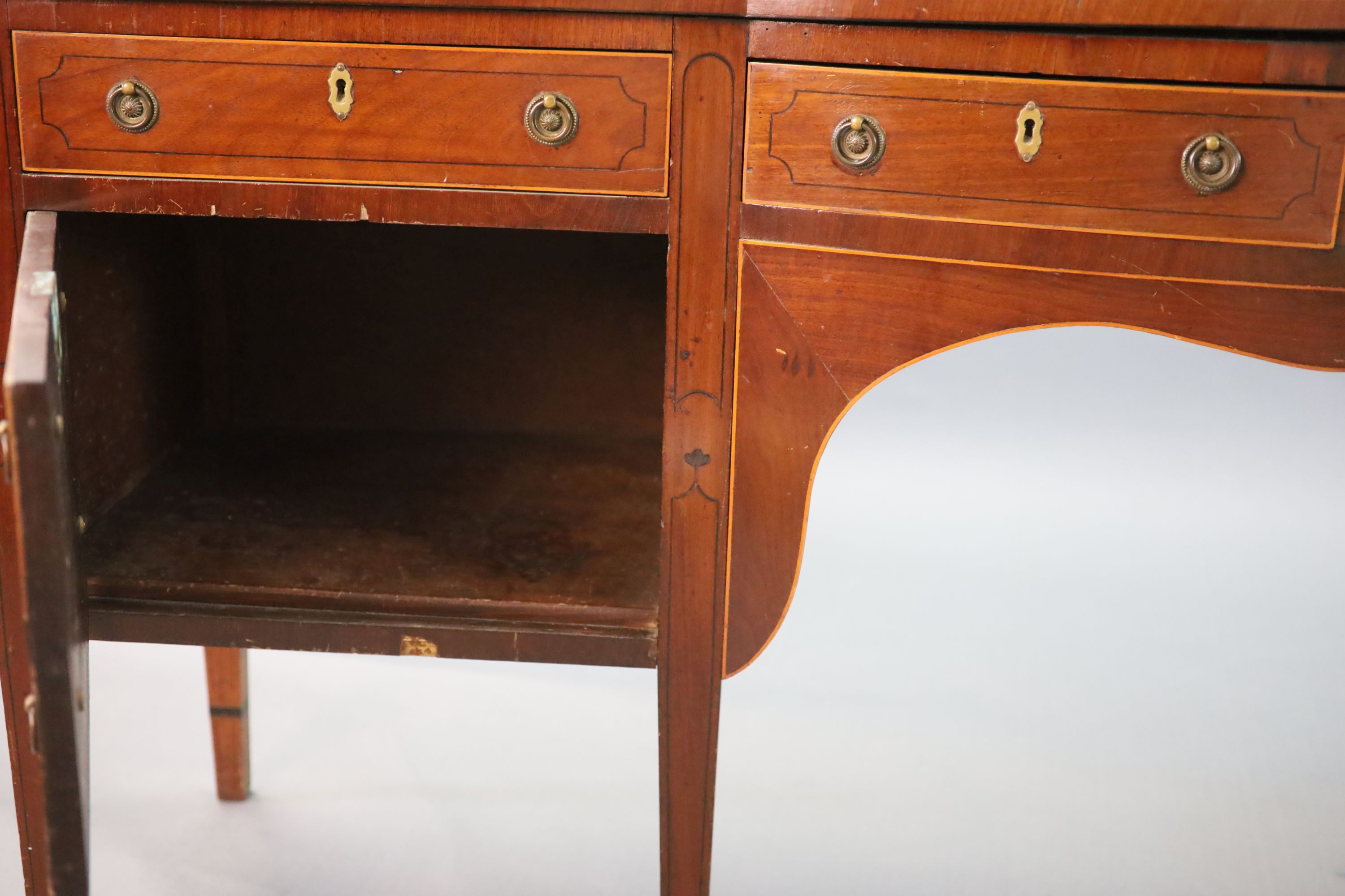 A Regency boxwood strung mahogany bowfront sideboard, W.241cm D.63cm H.118cm